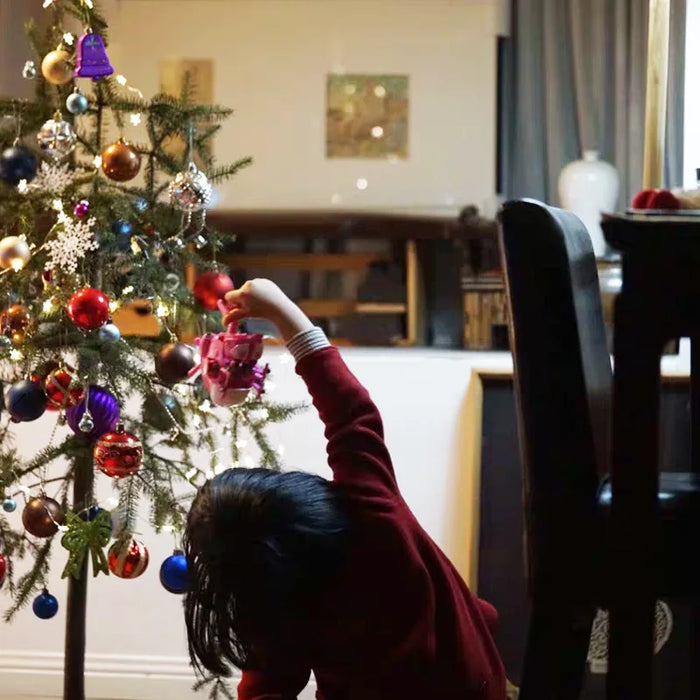 Christmas decorations - sparkling balls on trees, mantels and windows