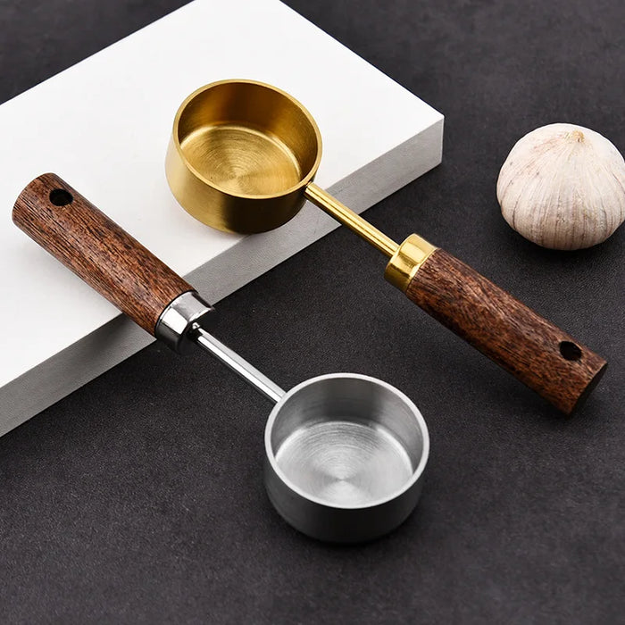 Stainless steel measuring spoon with wooden handle