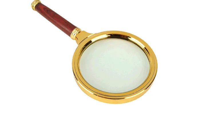 Elegant gold handle magnifying glass for reading newspapers