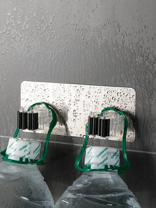 Heavy-duty adhesive wall-mounted mop and broom holders for bathroom storage and organization