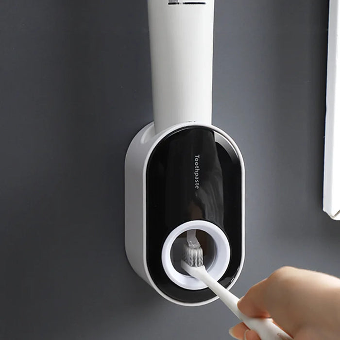 Household wall-mounted automatic toothpaste squeezer