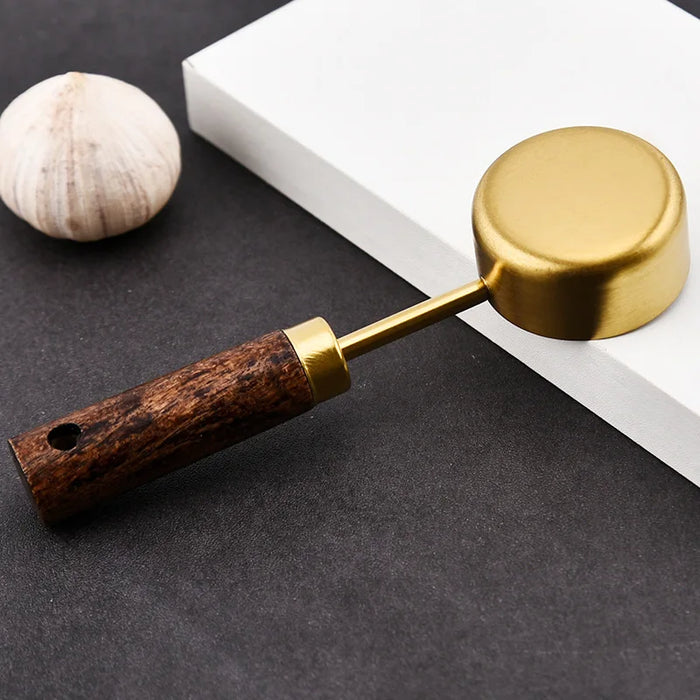 Stainless steel measuring spoon with wooden handle