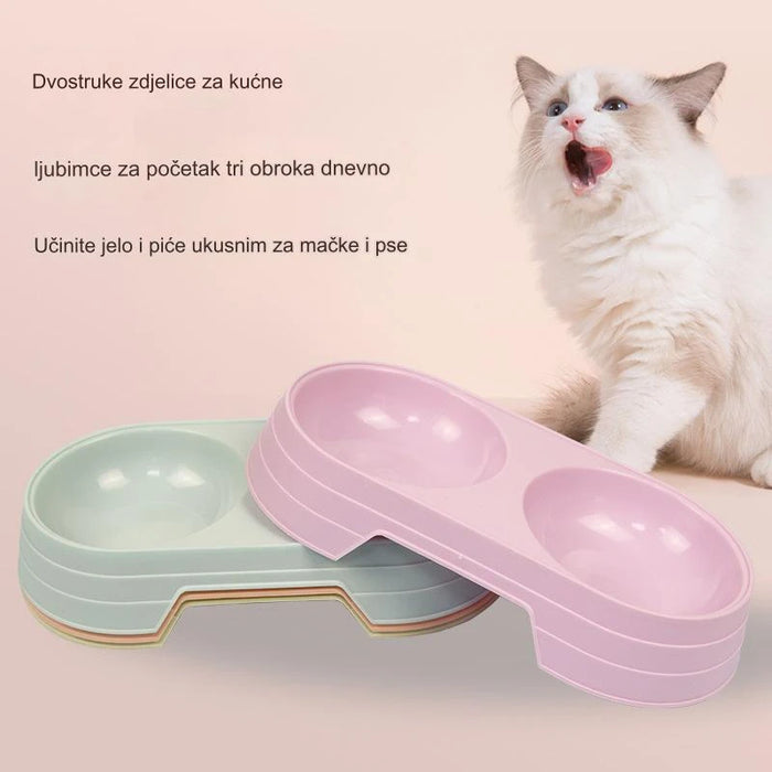 Round plastic pet food bowl with two bowls