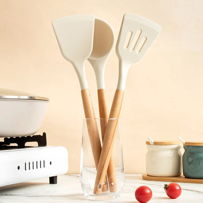 Premium cooking tools with wooden handles and non-stick pans