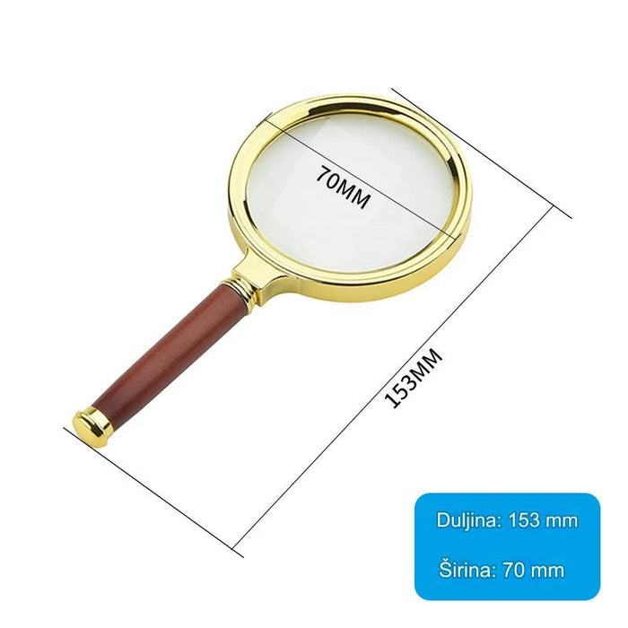 Elegant gold handle magnifying glass for reading newspapers