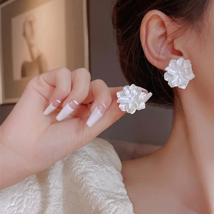 Unique Handcrafted Stud Earrings with White Floral Design and Sterling Silver Pin