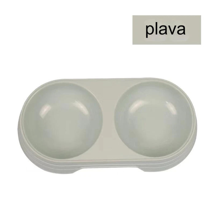 Round plastic pet food bowl with two bowls