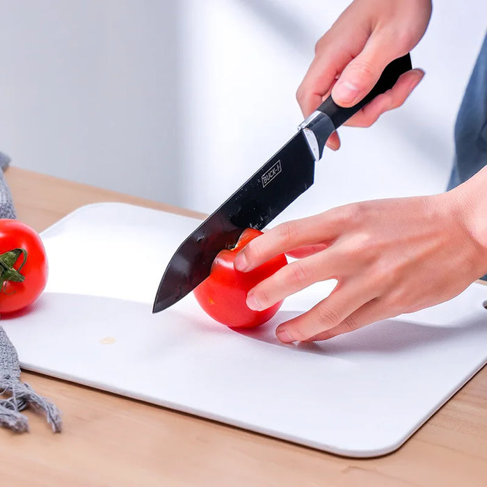 Durable plastic cutting board with polka dots